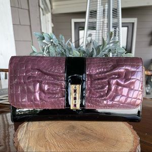 Purple and black clutch bag